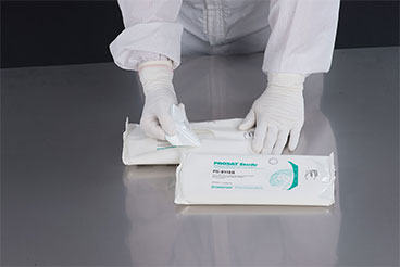 gloved hands grabbing contect wipes 