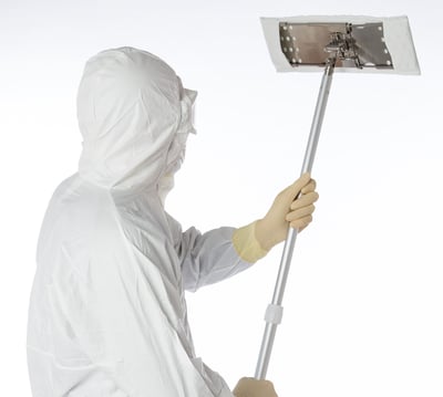 man in white sanitary suit using contec QuickTask mop
